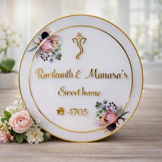 Round resin coated acrylic customised nameplate with golden letters and warm white backside LED light mounted on apartment wall, premium personalised home nameplate by Kraftorio