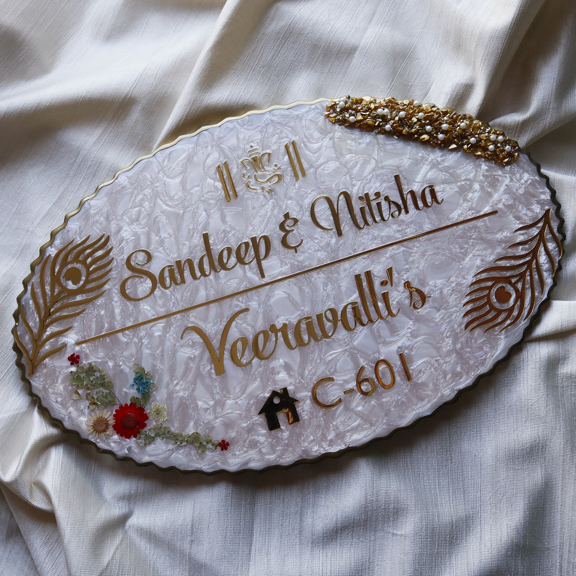 Resin material +golden font + real dry flowers on the side + wooden base