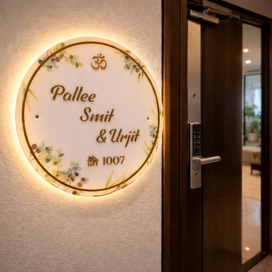 Round acrylic customised nameplate with clear resin finish and golden lettering installed on apartment wall, personalised home decor nameplate by Kraftorio
