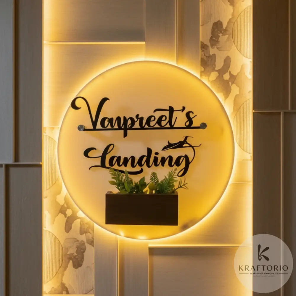 Round LED acrylic nameplate with planter box, custom Vangpreet’s Landing text and warm glow – modern entrance decor by Kraftorio